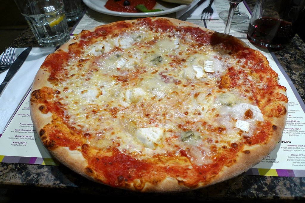 Pizza_quattro_formaggi_at_restaurant,_Chalk_Farm_Road,_London