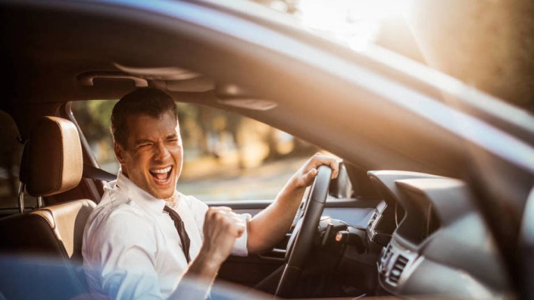 close-up-photo-of-a-businessman-driving-a-car