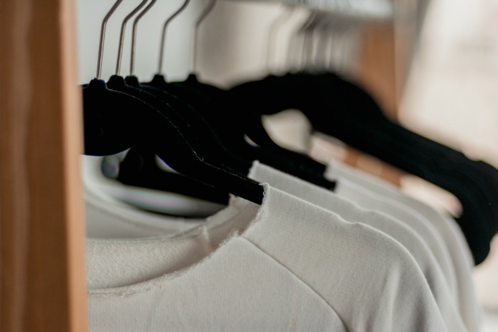 hanged-white-shirts-on-black-clothes-hangers-2112648