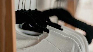 hanged-white-shirts-on-black-clothes-hangers-2112648