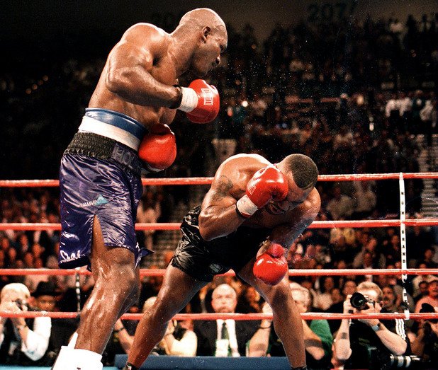 9. Най-накрая! Ивендър Холифийлд - Майк Тайсън (бой номер едно). 9 ноември 1996 г., Гардън Парадайс, Невада. В тази вечер Ивендър Холифийлд докосва величие, като става първият боксьор след Мохамед Али, печелил шампионската титла в тежка категория 3 пъти. Той е претендент, както и аутсайдер на букмейкърите. Боят е наречен "Най-накрая" от световната преса, която го чака от години между двамата. Срещата върви равностойно, докато в 6-ия рунд Тайсън получава тежка аркада от удар с глава на Ивендър, който съдиите считат за неволен. Шампионът е разклатен, а в осмия рунд при замахване с голяма сила Тайсън не улучва Холифийлд, който успява да избегне удара, но двамата си сблъскват главите. Тайсън крещи от болка, защото това е удареното по-рано място и кръвта трудно е спряна. Холифийлд нанася серия тежки удари и в 11-ия рунд мачът е спрян. Ивендър е шампион.