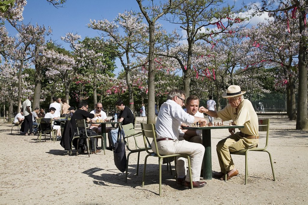 Old retired men playing chess at the Jardins du Luxembourg, Paris
