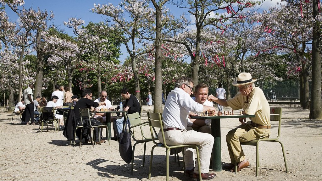 Old retired men playing chess at the Jardins du Luxembourg, Paris