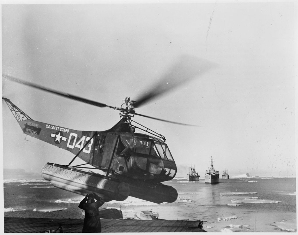 1280px-US_Navy_Antarctic_Expedition_Helicopter_returns_from_survey_of_South_Pole_waters._The_Coast_Guard_helicopter_is_shown..._-_NARA_-_196475