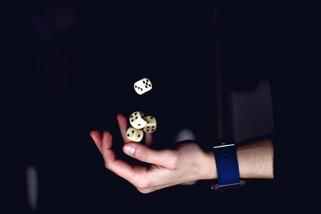 person-about-to-catch-four-dices-1111597