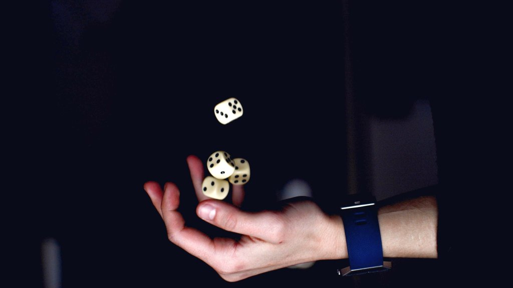 person-about-to-catch-four-dices-1111597