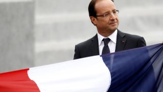 France's President Francois Hollande leaves after the traditional Bastille Day military parade in Paris