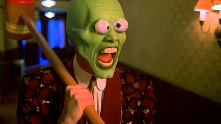 The Mask / Маската 
Кери бързо става и един от актьорите, участвали във филм по комикс, години преди това да е "готино", "модерно" и наистина доходоносно. Става дума, разбира се, за безспорния хит "Маската" от 94-а. Там Кери играе Стенли Ипкис – смотаняк със скучна работа, който намира стара дървена маска. Когато я сложи, Стенли се превръща в откачения и неконтролируем Маската, който може да променя себе си и обкръжението си както пожелае. А също така и да постигне успехи там, където самият Стенли не може.
Джим Кери тук се отдава напълно на смахнатостта си, играейки два различни образа. Зелената гумена маска не успява да му попречи отново да се възползва от мимиките, които са негова запазена марка, а комбинирайки ги с невероятна игра с тялото той създава един от най-иконичните си персонажи. Който, слава богу, никой все още не е ребуутнал.