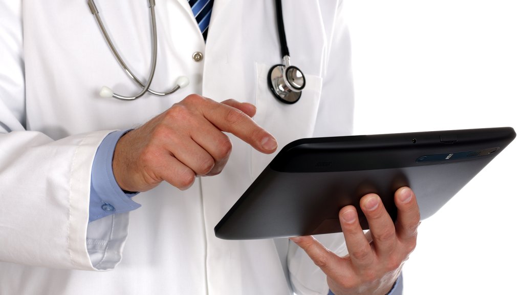 bigstock-doctor-using-a-digital-tablet-31270601