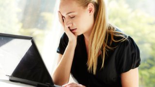 Stressed woman in office