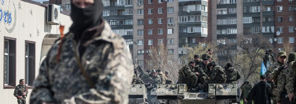 Man stands near tank in Slavyansk, Ukraine
