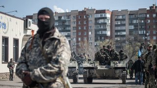 Man stands near tank in Slavyansk, Ukraine