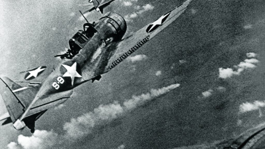 SBD-3_Dauntless_bombers_of_VS-8_over_the_burning_Japanese_cruiser_Mikuma_on_6_June_1942