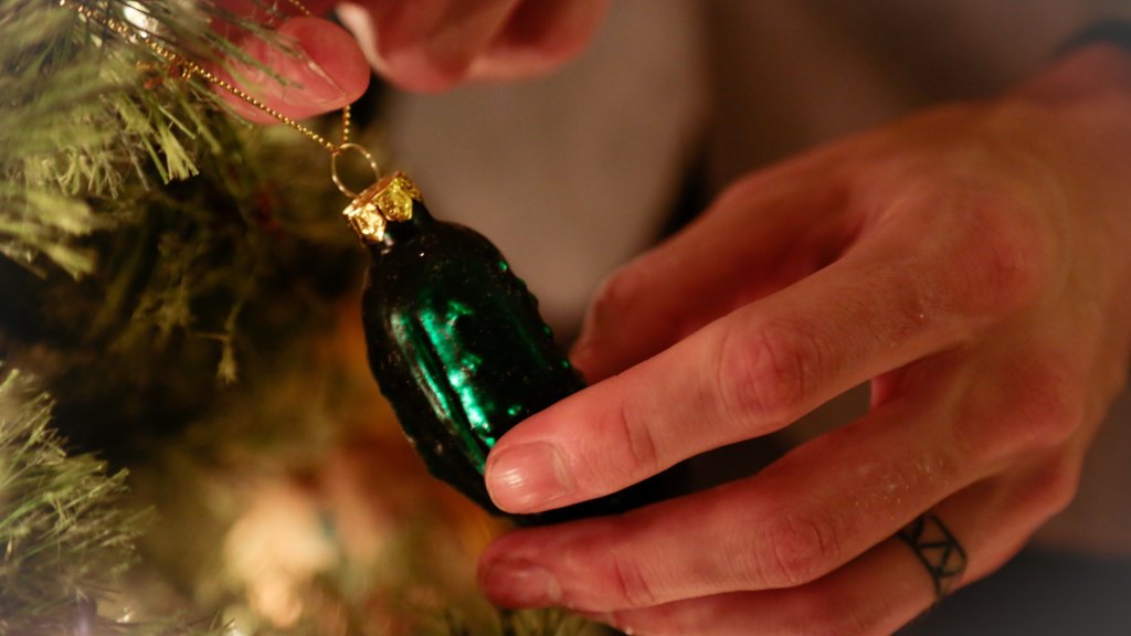 Hanging a Unique Ornament on the Christmas Tree