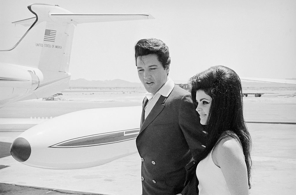 Elvis and Priscilla Presley at Airplane Door