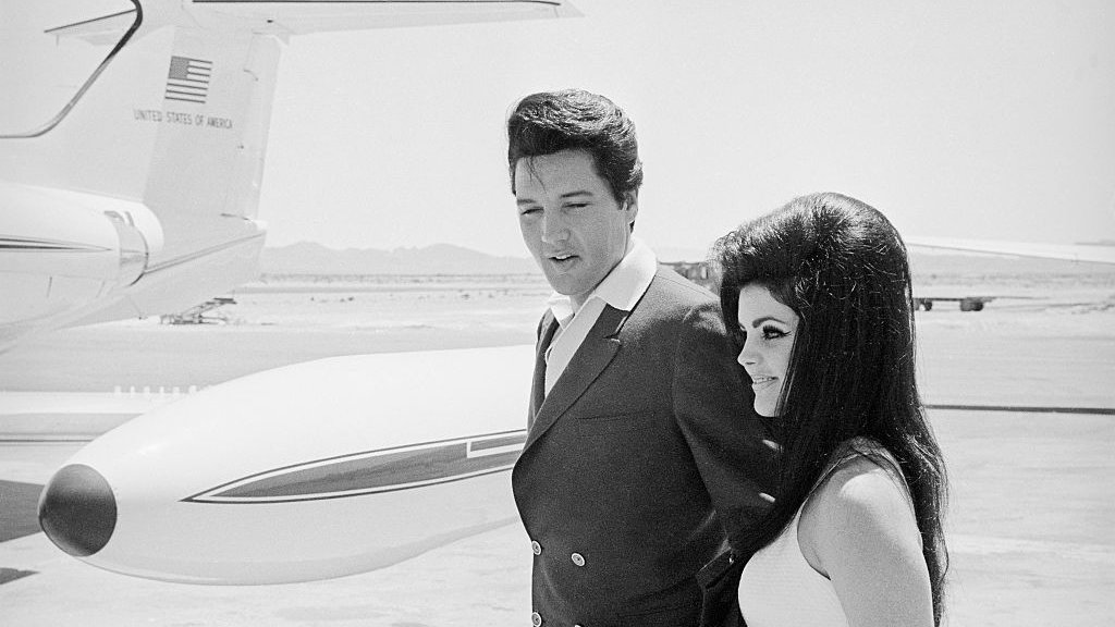 Elvis and Priscilla Presley at Airplane Door