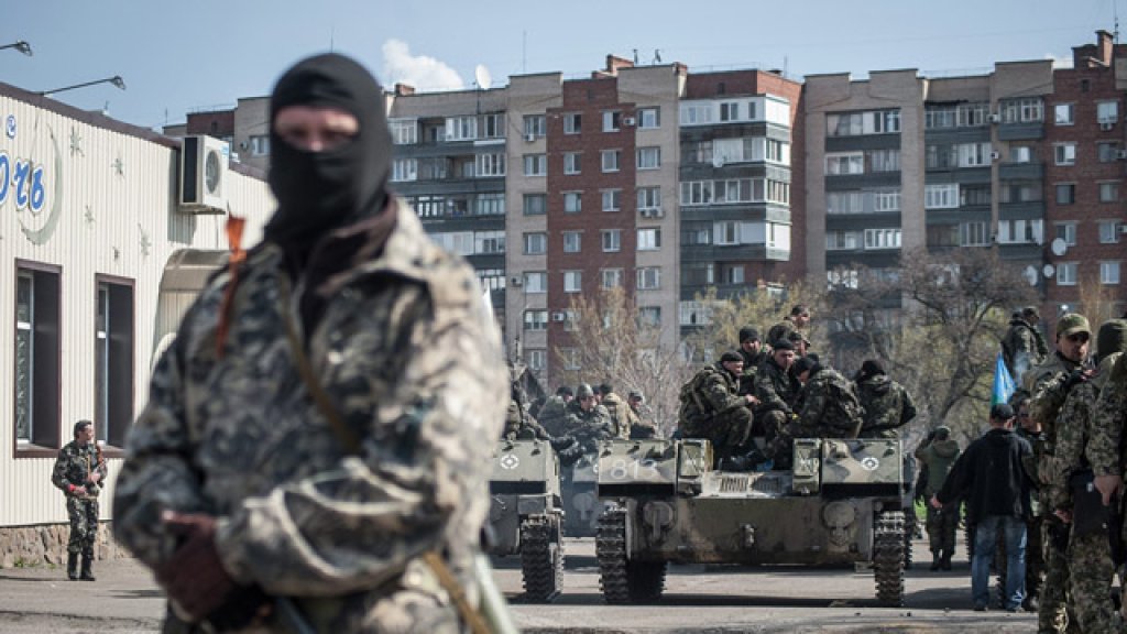 Man stands near tank in Slavyansk, Ukraine