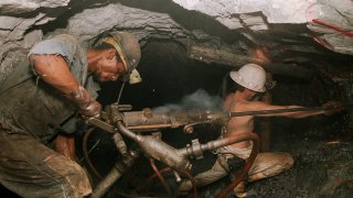 Miners Digging for Gold