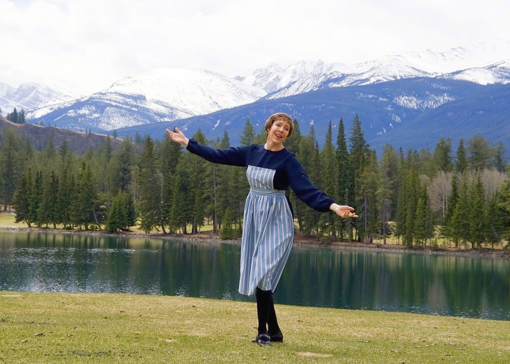 1280px-The_Hills_Are_Alive_With_The_Sound_of_Music._Tracey_Bell_impersonates_Julie_Andrews_(14964254648)