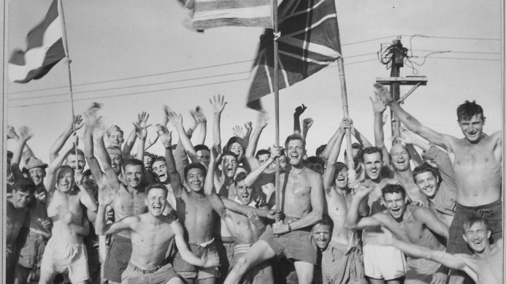 lossy-page1-837px-Gaunt_allied_prisoners_of_war_at_Aomori_camp_near_Yokohama_cheer_rescuers_from_U.S._Navy._Waving_flags_of_the_United..._-_NARA_-_520992.tif
