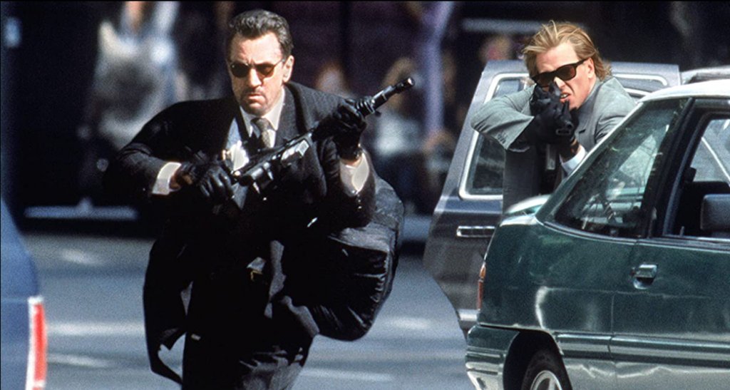 “Жега” (1995 г.) 
Къде да гледаме: под наем в Apple TV+
Макар че в екшъна на Майкъл Ман играе второстепенен персонаж, Килмър определя ролята си в “Жега” като любима. В лентата той дели екрана с двама титани в киното - Робърт де Ниро и Ал Пачино. И е споделял, че никога няма да забрави как е стрелял по колегите си с истински куршуми в сцената с обира на банката.