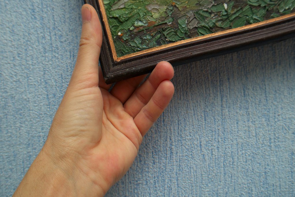 Hand arranging abstract paintwork