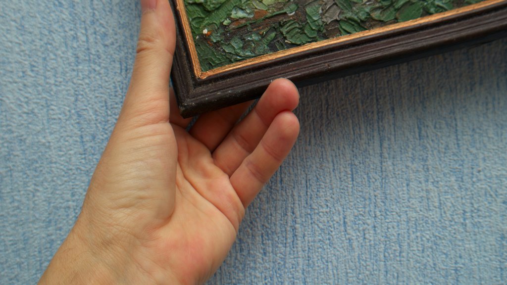 Hand arranging abstract paintwork