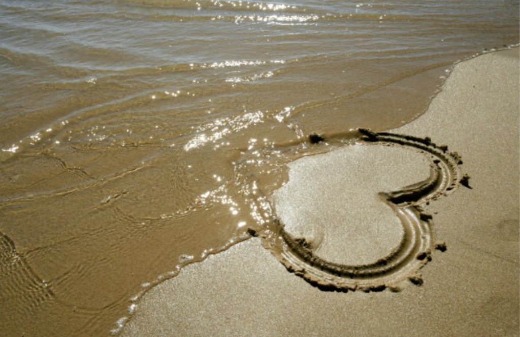 150756784-painted-heart-in-the-sand-gettyimages
