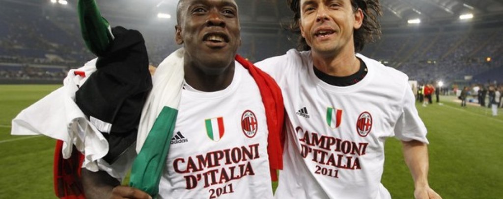 AC Milan's Seedorf and Inzaghi celebrate after winning the Serie A title in Rome