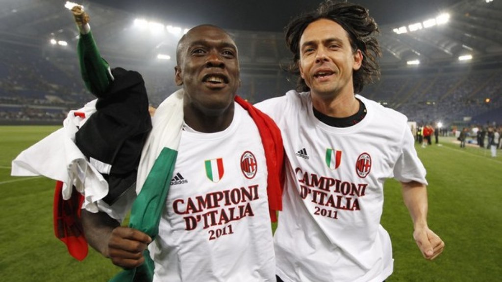 AC Milan's Seedorf and Inzaghi celebrate after winning the Serie A title in Rome