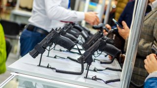 Gun Display Stands. Pistols for sale in the store.