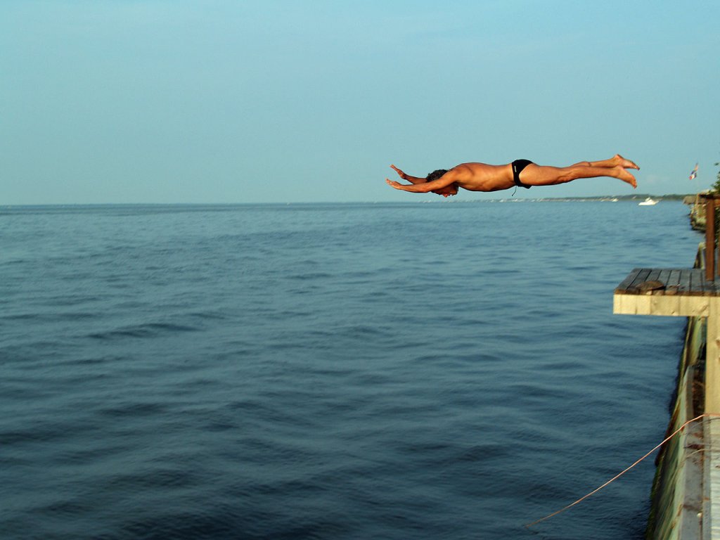 1280px-Diving_off_a_deck_into_the_Great_South_Bay_of_Long_Island