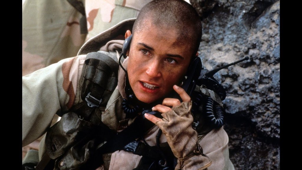 \"G.I. Jane\" (1997) 
С политическа помощ жена успява да бъде приета в специална, тежка военна програма, където всички очакват да се провали. 