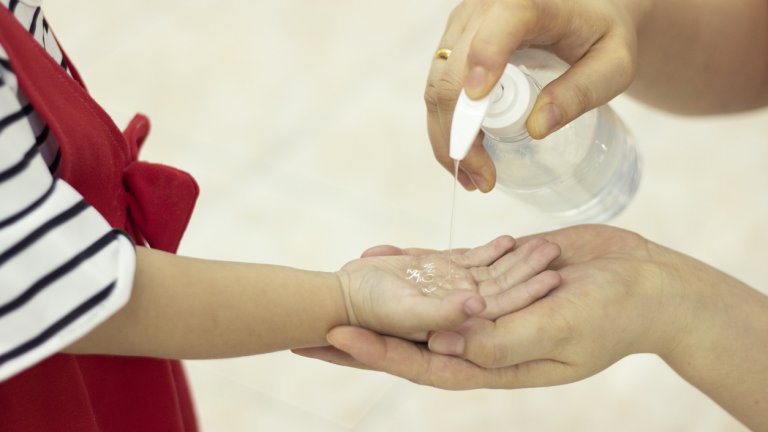 kid using sanitizer alcohol gel clean hand protection infection virus bacteria cleanser