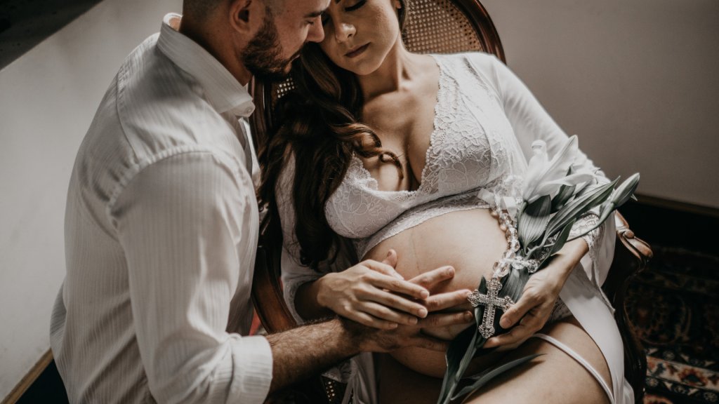 photo-of-pregnant-woman-sitting-on-wooden-chair-3369499