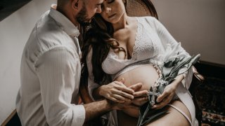 photo-of-pregnant-woman-sitting-on-wooden-chair-3369499