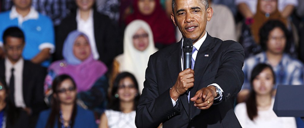 U.S. President Barack Obama points to the audience at the Young Southeast Asian Leadership Initiative (YSEALI) Town Hall inside the University of Malaya in Kuala Lumpur