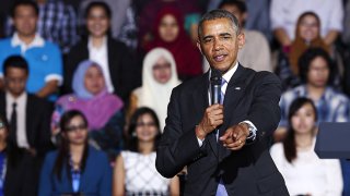 U.S. President Barack Obama points to the audience at the Young Southeast Asian Leadership Initiative (YSEALI) Town Hall inside the University of Malaya in Kuala Lumpur