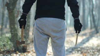 Maniac with knife and ax
