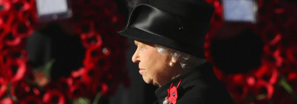 Queen Elizabeth II waits to lay wreath