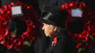 Queen Elizabeth II waits to lay wreath