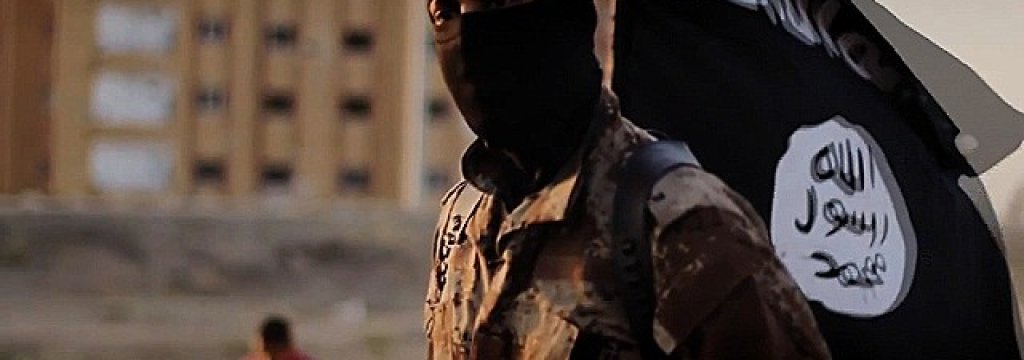141117103601-isis-masked-militant-flag-story-top