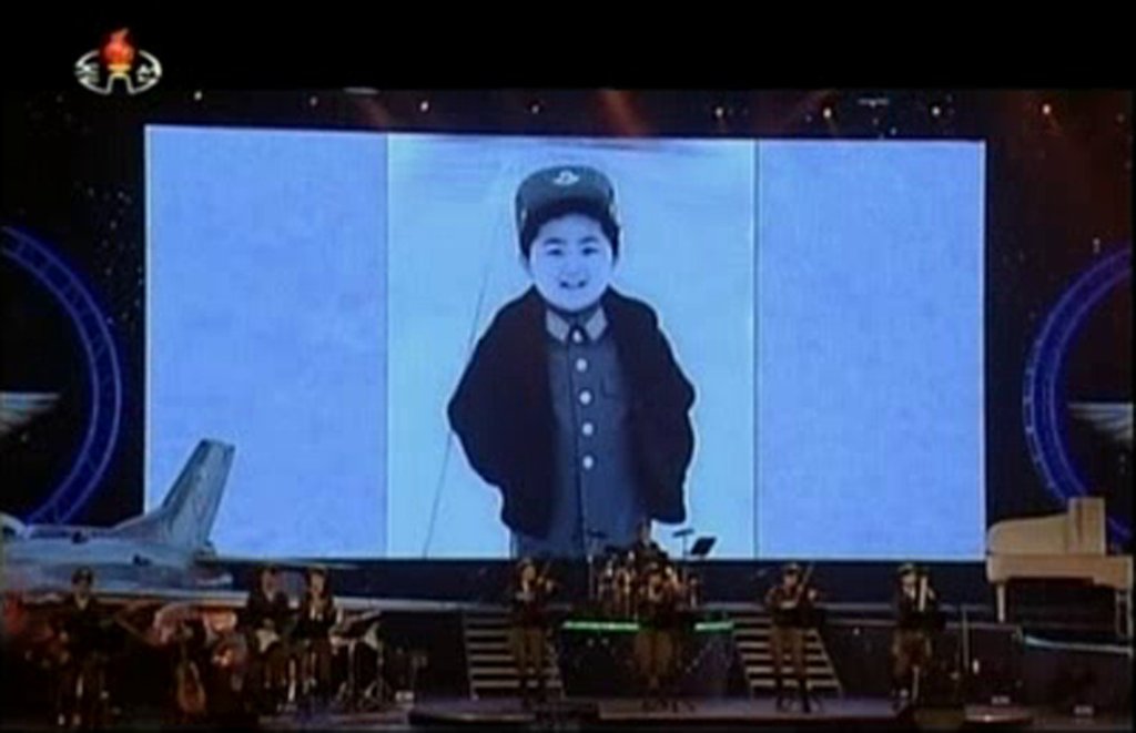 Still image from video broadcast by North Korea's state run television shows still photos of North Korean leader Kim Jong Un's childhood during a Moranbong concert in Pyongyang