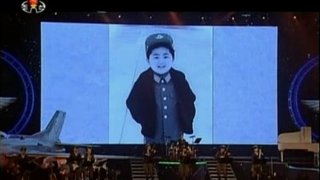 Still image from video broadcast by North Korea's state run television shows still photos of North Korean leader Kim Jong Un's childhood during a Moranbong concert in Pyongyang