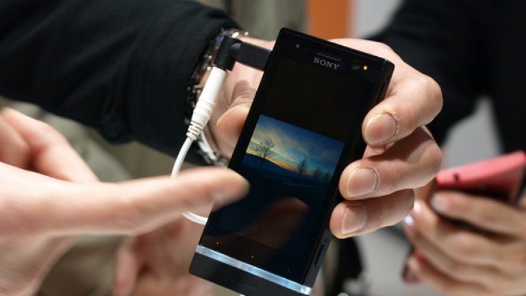 Xperia™ U - прозрачната лента посиня от снимката на екрана.