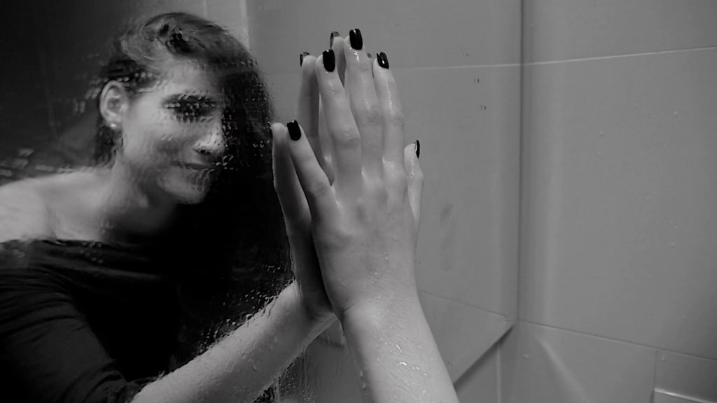 videoblocks-sad-woman-crying-touching-mirror-slow-motion-black-and-white_seigmj-lz_thumbnail-full04