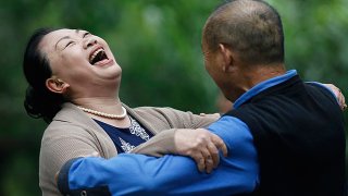 1414753092333_wps_1_A_Chinese_woman_laughs_du