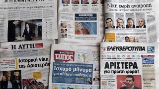 Greek newspapers are on display in Athen