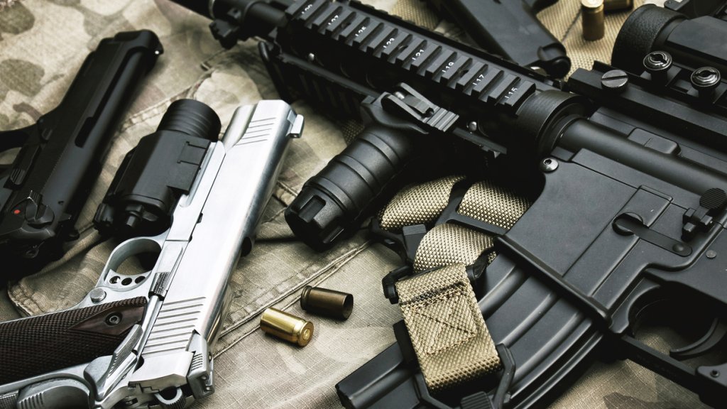 Weapons and military equipment for army, Assault rifle gun (M4A1) and pistol on camouflage background.