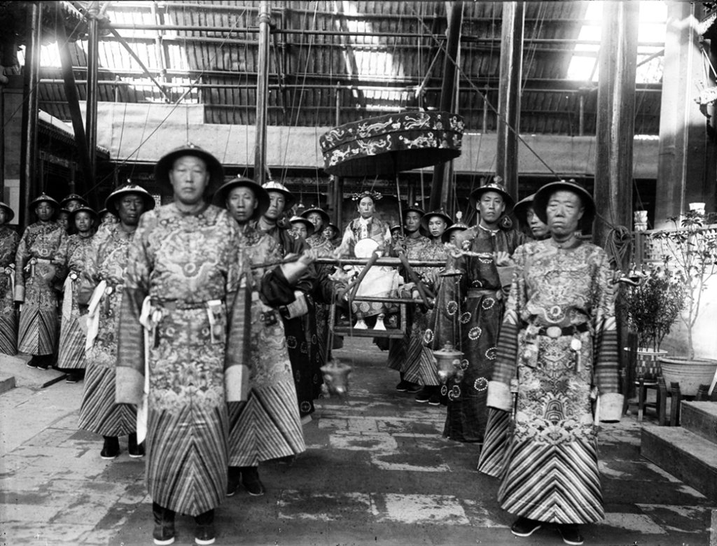 The_Qing_Dynasty_Cixi_Imperial_Dowager_Empress_of_China_On_Throne_Sedan_With_Palace_Enuches